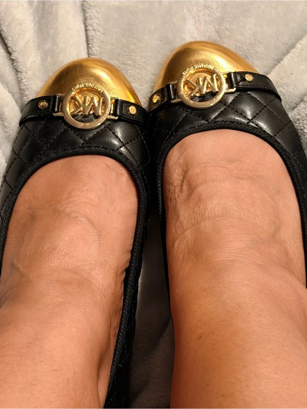Michael Kors Black Quilted Ballet Flats with Gold Toe Caps